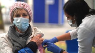 Woman getting her vaccine