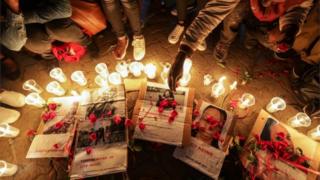 Kenyan activists light candles during a night vigil for the murdered university student Sharon Otieno, who was seven-month pregnant at the time of her death, as part of a protest to demand justice for her and other female university students who have been murdered in similar ways in Nairobi, Kenya, 14 September 2018