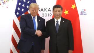 Donald Trump and Xi Jinping shake hands
