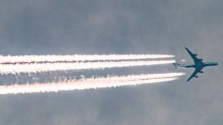 Airplane leaving trails in the sky