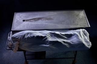 Wrapped body in a morgue. Part of 'Crossfire', a photo story by Shahidul Alam. November 20, 2009.