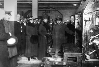 King George V and Queen Mary printing the first nomination war bond at the Bank of England, 1917