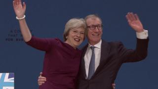 Theresa May and her husband Philip after the speech