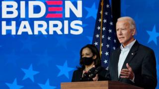 Democratic presidential nominee Joe Biden speaks as vice presidential nominee Sen. Kamala Harris (D-CA) listens at The Queen theater on November 05, 2020 in Wilmington, Delaware.