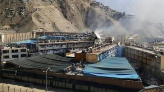 View of smoke arising from the Castro Castro prison during a riot in Lima on April 27, 2020