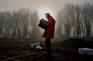 A man standing in mist