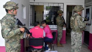 Members of the Mexican Navy stand guard next to electoral material, on June 30, 2018, in Acapulco