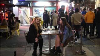 People drinking in Soho, central London