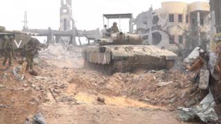 Israeli tank in destroyed Gaza village
