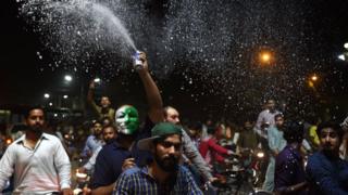 Pakistani cricket fans celebrate winning the International Cricket Championship (ICC) Champions Trophy final cricket match against India