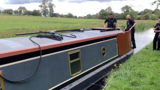 Police on Mr Tomlinson's boat