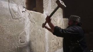 IS image from April 2015 reportedly showing militant taking a sledgehammer to an Assyrian relief