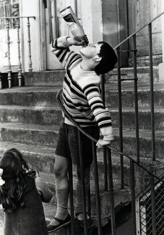 Boy swigging Coca-Cola, 1966