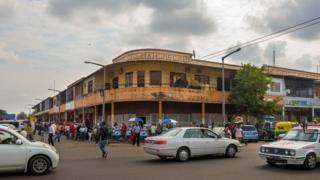 Image shows a street scene in Maputo, Mozambique