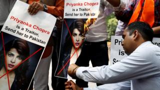 Supporters of Hindu Sena, a right wing Hindu group, shout slogans and burn posters of Bollywood actress Priyanka Chopra during a protest in June 9 2018
