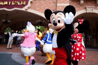 Mickey Mouse greets visitors