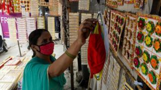 Woman sellign face masks in India