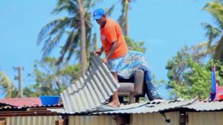 A resident repairing his damaged house following Cyclone Winston in Fiji's Ba district (22 February 2016)
