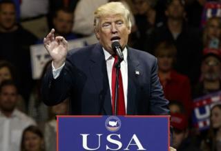 President-elect Donald Trump gestures as he speaks during a "USA Thank You" tour event in Cincinnati.