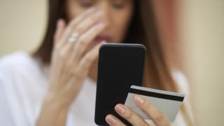 A woman looking at her mobile phone