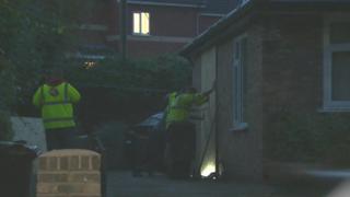 Workers were seen boarding up a section of the house
