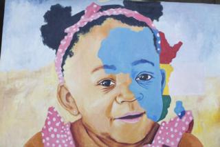 A mural depicting a child with vitiligo