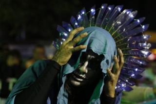 An artists dressed as La Llorona, the Weeping Woman of legend