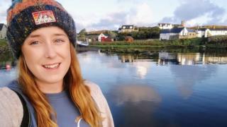 Kay beside a loch