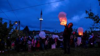 People in Sarajevo release sky lanterns to mark the beginning of Ramadan