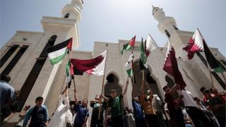 أعلام قطر وفلسطين