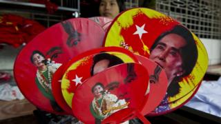 Various fans with portraits of Myanmar opposition leader Aung San Suu Kyi are seen for sale outside the National League for Democracy (NLD) party headquarters in Yangon on November 11, 2015