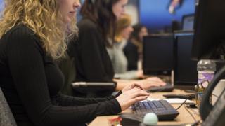 Woman works on computer