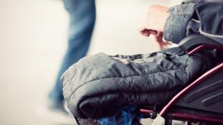 Close-up of a man sitting in a wheelchair