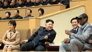 January 08, 2014 North Korean leader Kim Jong-Un (C), his wife Ri Sol-Ju (L) and former US basketball star Dennis Rodman (R) watching a basketball game between former NBA players and North Korean players at Pyongyang Gymnasium in Pyongyang.
