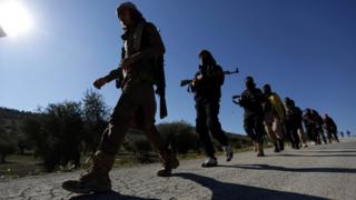 Free Syrian Army fighters marching near Afrin on 17 March 2018