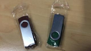 A pair of USB sticks like those left in residents' letterboxes