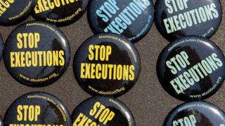 Buttons were for sale as death penalty opponents mark the 40th anniversary of the Supreme Court's landmark Furman v. Georgia decision outside the court