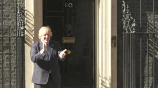 Prime Minister Boris Johnson takes part in the clap from outside Downing Street