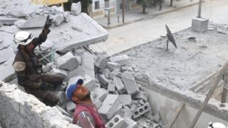 Rescue teams in the rubble of a building in Aleppo. 3 May 2016
