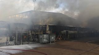 Burnt-out coaches at the garage after the fire