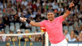 Trevor Noah celebrates winning a point in a tennis match in Cape Town, South Africa - Friday 7 February 2020