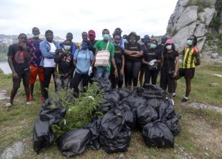 Volunteer cleaners at Mpape Crushed Rock near Abuja, Nigeria