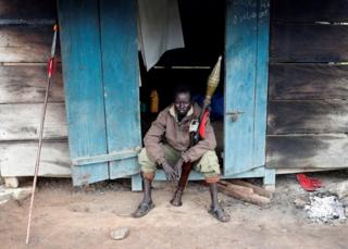 A rebel soldier posing with his weapon