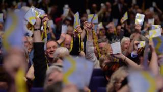 SNP delegates waiving their accreditation at the 2017 conference