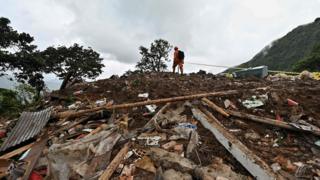 A rescue worker searches for victims