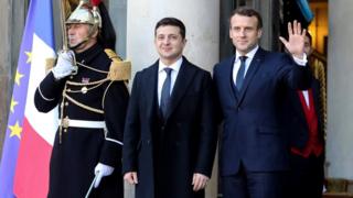 French President Emmanuel Macron (R) welcomes Ukrainian president Volodymyr Zelensky at the Elysee Palace, Paris, 9 December 2019