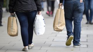People carrying shopping bags