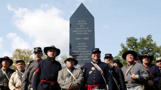 Members of Grays and Blues pose in front of Canada's first Civil War monument