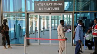 A member of the security services standing guard at the departures area of Mogadishu airport in Somalia - 11 February 2016