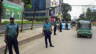Bangladeshi police stand guard during a nationwide crackdown on militants, in Dhaka on June 13, 2016.